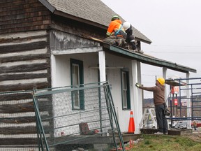Workers with Almaguin Building Movers prepare for the relocation of the birth home of the Dionne Quintuplets by removing the porch in this file photo. 
Gord Young/The Nugget