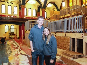 Matthew Clark and Kristen Wadey, members of the Queen's University Science Formal organizing committee, and fourth year engineering students, stand in the middle of the chaos of the construction, painting and last minute touches to this Saturdays Science Formal in Grant Hall at Queen's University in Kingston, Ont. on Thursday November 2, 2017. Julia McKay/The Whig-Standard/Postmedia Network