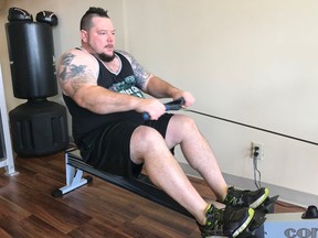 Jan Murphy rows during his workout at Reflections Training Studio in Kingston.