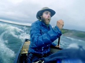 Solo traveller Adam Shoalts reacts to a wave that struck his canoe broadside. Afterwards, he had to paddle to shore, remove all his gear and dump out the water that had swamped his canoe. (Photo supplied)