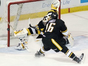 Kingston Frontenacs goalie Jeremy Helvig makes a save on Sarnia Sting's Jordan Ernst at the Rogers K-Rock Centre in Kingston, Ont., on Friday, Nov. 3, 2017. (IAN MACALPINE/Postmedia Network)