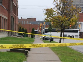 Crime scene tape marks the spot where a man was found stabbed Sunday morning. (NEIL BOWEN/The Observer)