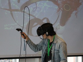 Nick Duranleau tries virtual reality painting during the South Western International Film Festival. (NEIL BOWEN/The Observer)