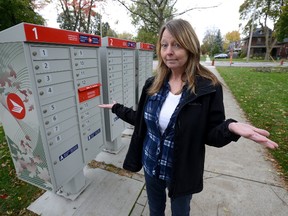 New group mailboxes like these near Grosvenor and Maitland streets, have doorstep delivery advocates like Londoners for Door-to-Door?s Wendy Goldsmith worried. (MORRIS LAMONT, The London Free Press)