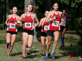 Northern Vikings' Kaylee White (186), Lauren Perkins (184), Bryar Fournie (168) and Caroline Forbes (167) compete in the senior girls' six-km race at the LKSSAA cross-country championship at Canatara Park in Sarnia, Ont., on Thursday, Oct. 19, 2017. (Mark Malone/Postmedia Network)