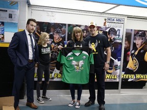 Lambton Junior Sting head coach Alex McFadden and Randi Babcock present a cheque for $1,500 to Kim and Brent Shaw, parents of Steph Shaw, a 17-year-old who died by suicide in 2016. The Shaws gave the cheque to St. Clair Child and Youth Services to assist youth in need in the community.
Photo courtesy of Jamie Nicole Babcock