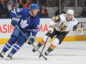 Reilly Smith #19 of the Vegas Golden Knights skates to check Auston Matthews #34 of the Toronto Maple Leafs during an NHL game at the Air Canada Centre on November 6, 2017 in Toronto, Ontario, Canada. (Photo by Claus Andersen/Getty Images)