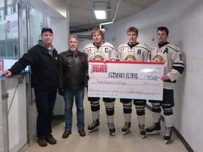 (L-R): Goderich Flyers' Assistant General Manager Dan Kerr, John Harrison, and Flyer players Morgan Benniwies, Trent Michie, and Noah Nurse. (Contributed photo)