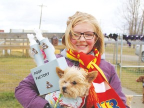 Grace Gardiner with her dog Remy, a.k.a. Poop Factor, won the Halloween Howler Best Costume contest in a costume designed by Grace.