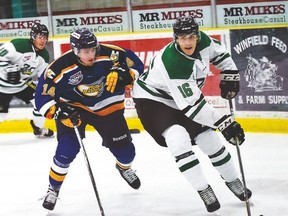 Hockey action between the Drayton Valley Thunder and the Ft. McMurray Oil Barons