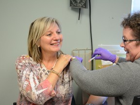 Whitecourt Mayor Maryann Chichak (left) receives her influenza vaccination for the season at the Whitecourt Healthcare Centre on Nov. 3. (Peter Shokeir | Whitecourt Star).