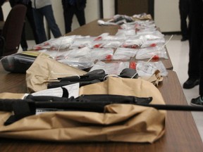 Weapons and cash seized during an arrest in the parking lot of a city bank Oct. 31.
Nugget File Photo