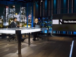 New CBC The National news anchors Ian Hanomansing, left, and Adrienne Arsenault rehearse a news cast in Toronto on November 1, 2017. Can four new hosts take the place of an anchor who led CBC's "The National" for nearly 30 years? It will take more than one newscast to properly judge, but CBC demonstrated Monday that its new team-approach to the nightly news at the very least looks different -- and younger -- than what rival broadcasters have to offer. THE CANADIAN PRESS/Nathan Denette