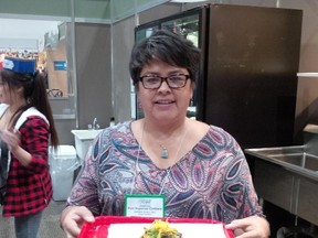 Pam Naponse-Corbiere of Nish Scon (Naughton) whips up what she calls a Northern Ontario taco in the Northern Cuisine booth located in the Northern Ontario Agri-food Pavilion at the 2017 Royal Agricultural Winter Fair in Toronto. Supplied photo