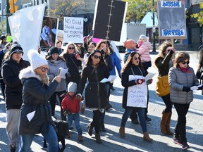Dozens of families held a rally in Victoria Park protesting long waits for access to autism services on Wednesday, November 8, 2017. Following the rally the protesters marched to MPP Deb Matthews office.
(MORRIS LAMONT, The London Free Press)