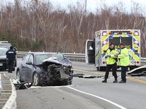 Ontario Provincial Police investigate a fatal collision at Middle Lake Road and the Highway 17 southwest bypass in Sudbury, Ont. on Wednesday November 8, 2017. John Lappa/Sudbury Star/Postmedia Network
