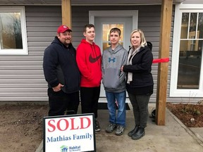 The Mathias Family, from left, James, Dylan, Joseph and Rachel, will be able to move into their Habitat for Humanity home in Roblin by the end of November. The family received a ceremonial key and other gifts on Nov. 2. (HABITAT KINGSTON/Supplied Photo)