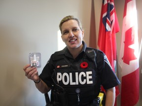 Const. Tanya Calvert holds up Narcan nasal spray, an antidote to an opioid overdose. Each St. Thomas police officer will be carrying them while on duty within the week. (Laura Broadley/Times-Journal)