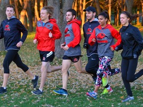 Members of the Fanshawe College cross-country team Alastair Thompson, left, Kyle Luyt, Dean VanHerpe, Jordan Kadlecik, Nicole Sharma and Sammi Jo Burch practise on the college grounds on Wednesday. The Falcons are competing in the national championships in Quebec on Saturday. (MORRIS LAMONT, The London Free Press)