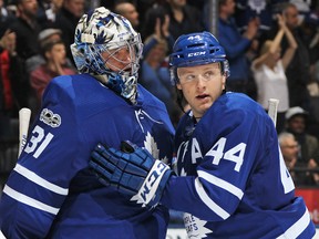 Goalie Frederik Andersen #31 of the Toronto Maple Leafs is congratulated by teammate Morgan Reilly #44 after defeating the Minnesota Wild during an NHL game at the Air Canada Centre on November 8, 2017 in Toronto, Ontario, Canada. The Maple Leafs defeated the Wild 4-2. (Photo by Claus Andersen/Getty Images)