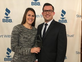 Bluestone Properties vice-presidents Jaclyn Pisarczyk and Colin Bierbaum celebrate their big win Thursday morning at the London-area's Better Business Bureau 2017 Business Integrity Awards. (Jennifer Bieman/The London Free Press)