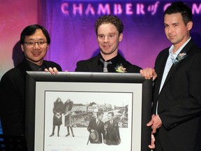 Stony Plain Mayor William Choy (left) awards the Ambassador of Action award to Dr. Cory de Jong (centre) and Dr. Fred Lobay (right) during the Stony Plain & District Chamber of Commerce awards banquet on Nov. 3 at the Stony Plain Best Western Inn & Suites.