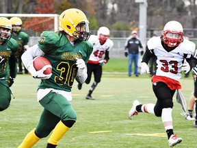 Centennial halfback Carson Waite runs the ball against the Crestwood D during the COSSA AAA senior football final Thursday at MAS 2. (Cliff Malone for The Intelligencer)