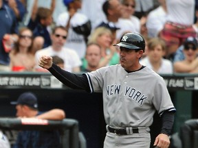In this July 2, 2011, file photo, New York Yankees third base coach Rob Thompson reacts as Yankees' Curtis Granderson hit a home run during the sixth inning of a baseball game against the New York Mets in New York. Thomson, a bench coach on the Joe Girardi?s staff for the past decade, is the first candidate to be interviewed to replace the New York Yankees manager. (AP Photo/Kathy Kmonicek, File)