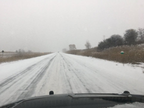 Snow-covered Highway 401 west of London Friday morning. (OPP photo)