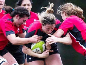 Belleville natives Cindy Nelles (left) and Sara Svoboda (right) converge on a ballcarrier during an intra-squad match at the Canadian senior women's rugby training camp held in March on Vancouver Island. (Rugby Canada photo)