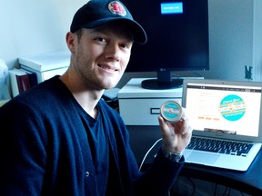 Matt Laberge holds Clap Balm, a hockey hand odour fighter he and fellow hockey player Dan Black invented in 2015. They’re launching the product in Australia this month and plan to expand into Germany soon. (Louis Pin/Times-Journal)