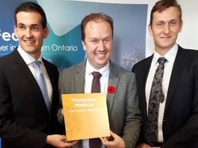 Andrew Eibl, COO and co-founder of Flosonics Medical, along with Sudbury MP Paul Lefebvre, and Joe Eibl, CEO of Flosonics Medical during a funding announcement on Friday at Flosonics Medical headquarters. Keith Dempsey/For The Sudbury Star.