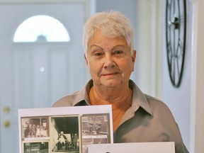 Mary Megan Galloway holds up photos of her father, William Glen Galloway, who served in both the First and Second World Wars, inside her Chatham home on Nov. 10.