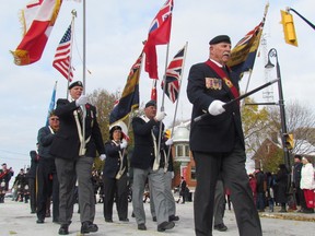 Sgt. At Arms Jack Burns leads the colour guard during Saturday's Remembrance Day Parade to the cenotaph in Sarnia's Veteran's Park.
 Paul Morden/Sarnia Observer/Postmedia Network