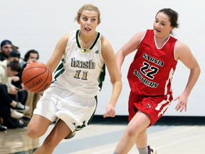 Breanna Pretty (11) of the St. Patrick's Fighting Irish is chased by Northern Vikings' McKenna Jackson (22) in the first half of the LKSSAA AAA senior girls' basketball final at St. Patrick's Catholic High School in Sarnia, Ont., on Saturday, Nov. 11, 2017. Mark Malone/Chatham Daily News/Postmedia Network