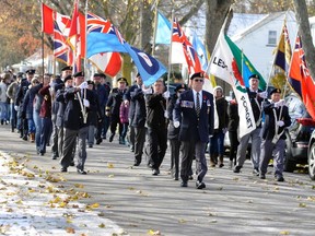 The colour party of the Royal Canadian Legion, br. 128 in Mitchell, marched north on St. Andrew Street to the Mitchell District High School (MDHS) for their annual Remembrace Day ceremony held on Saturday, Nov. 11. ANDY BADER/MITCHELL ADVOCATE