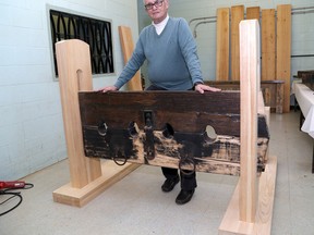 Ian MacAlpine/The Whig-Standard
George Caron, a former warden at The Prison For Women, shows off a refurbished inmate stock at the Joyceville Institution Hobby Shop. Caron wants to find out if the stock was used at Kingston Penitentiary in the 1800s.