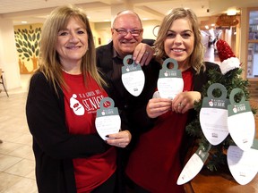 Lisette Wirta, left, owner of Home Instead Senior Care, Greater Sudbury Mayor Brian Bigger, and Nikki Sage, of  Home Instead Senior Care, were on hand for the launch of the 2017 Be a Santa to a Senior program at Pioneer Manor in Sudbury, Ont. on Tuesday. John Lappa/Sudbury Star/Postmedia Network