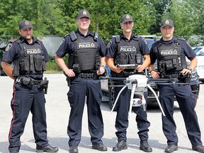 Chatham-Kent Police Service officers trained to operate the drone are pictured during a demonstration of the device in August. The officers include Const. Jason Herder, left, Sgt. Michael Pearce, Sgt. Matt Stezycki, and Const. Josh Flikweert.