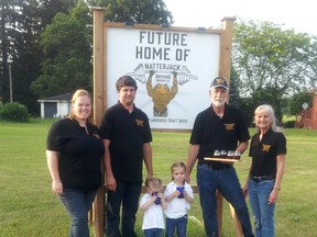 The Soos family of West Lorne is hoping to open the Natterjack Brewing Company next spring. The venture in Eagle is being done in memory of Matt Soos who was an aspiring craft brewmaster when health complications took his life in 2015. From left are: Matt’s sister-in-law Racheal, his older brother Dan, their daughters Danica and Elise, and his parents Peter and Kathy, as they stand beside the family business sign for Matt’s Dream.