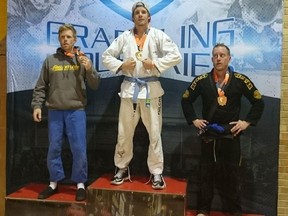 Huron BJJ head instructor and Blue Belt, Shaun Gregory, poses with the gold medal he earned at the Nov. 4 Brazilian Jiu-Jitsu tournament. Two of Gregory's Huron BJJ students from the Clinton area, both White Belts, claimed silvers in their divisions. (PHOTO COURTESY OF SHAUN GREGORY)