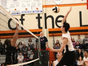 Jason Diotte, right, of Lasalle Lancers, spikes the ball during senior boys volleyball final action against the Horizon Aigles at Lasalle Secondary School in Sudbury, Ont. on Saturday November 11, 2017. John Lappa/Sudbury Star/Postmedia Network