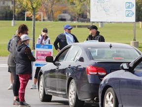 Local college faculty picket and speak with drivers entering all three entrances to St. Lawrence College Kingston campus last month. Ontario's Liberal government Thursday moved to introduce back-to-work legislation that would end a nearly five-week strike by college faculty, though opposition from the NDP means it may not happen quickly. (Julia McKay/Whig-Standard file photo)