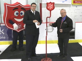 BRUCE BELL/THE INTELLIGENCER
Mayor Robert Quaiff (right) kicks of the Salvation Army Christmas Campaign with Lt. Joe Ludlow and the Salvation Army mascot at the Picton Pirates game Thursday night.