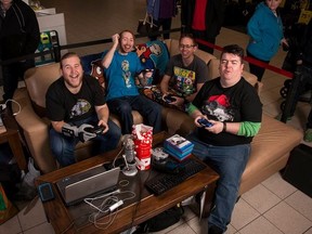 Max Major, left, and Darryl Heater (in blue) are headed back to Lambton Mall for another Playing for Charity 24-hour gaming marathon. Pictured playing with them in the inaugural event in 2015 are David Evans, right, and Eric Soepboer. (Handout)