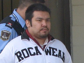 Byron Spence, who was ultimately convicted of first-degree murder in connection with the Oct. 24, 2009 shooting death of his half-brother Jonah Trapper, is seen here being led out of the Timmins superior courthouse on Sept. 11, 2014. Spence who was granted an appeal on that conviction and a new trial ordered made his first court appearance in Timmins, via video, since that decision.