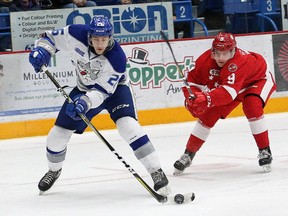 Anthony Tabak, left, of the Sudbury Wolves, attempts to elude Rasmus Sandin, of the Soo Greyhounds, during OHL action at the Sudbury Community Arena in Sudbury, Ont. on Friday November 17, 2017. John Lappa/Sudbury Star/Postmedia Network