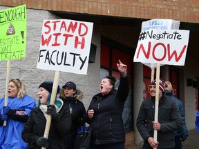 Striking faculty at Cambrian College and College Boreal, and their supporters, take part in a rally outside Minister of Energy and Sudbury MPP Glenn Thibeault's office in Sudbury, Ont. on Thursday November 9, 2017. John Lappa/Sudbury Star/Postmedia Network