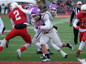 Cedric Joseph scores one of his three rushing touchdowns in Saturday's 81-3 win over the Acadia Axemen. Joseph and the Western Mustangs will now play in the national championship, the Vanier Cup, next weekend. (Canadian Press)