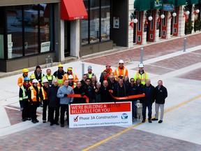 Members of city council, staff, the Belleville Downtown Improvement Area and contractors gather for a ribbon cutting on the newly-reopened Bridge Street East Monday. It marked the completion of Stage 3A of the City Centre Revitalization and Redevelopment project. It included major replacement and upgrading of underground infrastructure plus resurfacing, new lighting and trees intended to create a more pedestrian-friendly street. Phase 3B, which includes work on Front Street between Bridge and Dundas Streets and the north and south sides of Market Square, is to end in 2018.